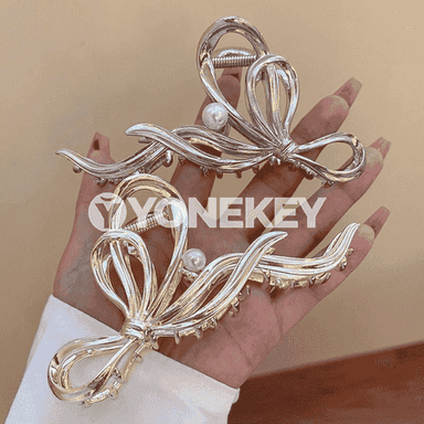 Altyn-söw reňkli, özüne çekiji saç aksesuary