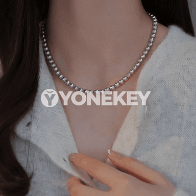 Zenanlar üçin owadan görnüşli merjen monjukly zynjyr.